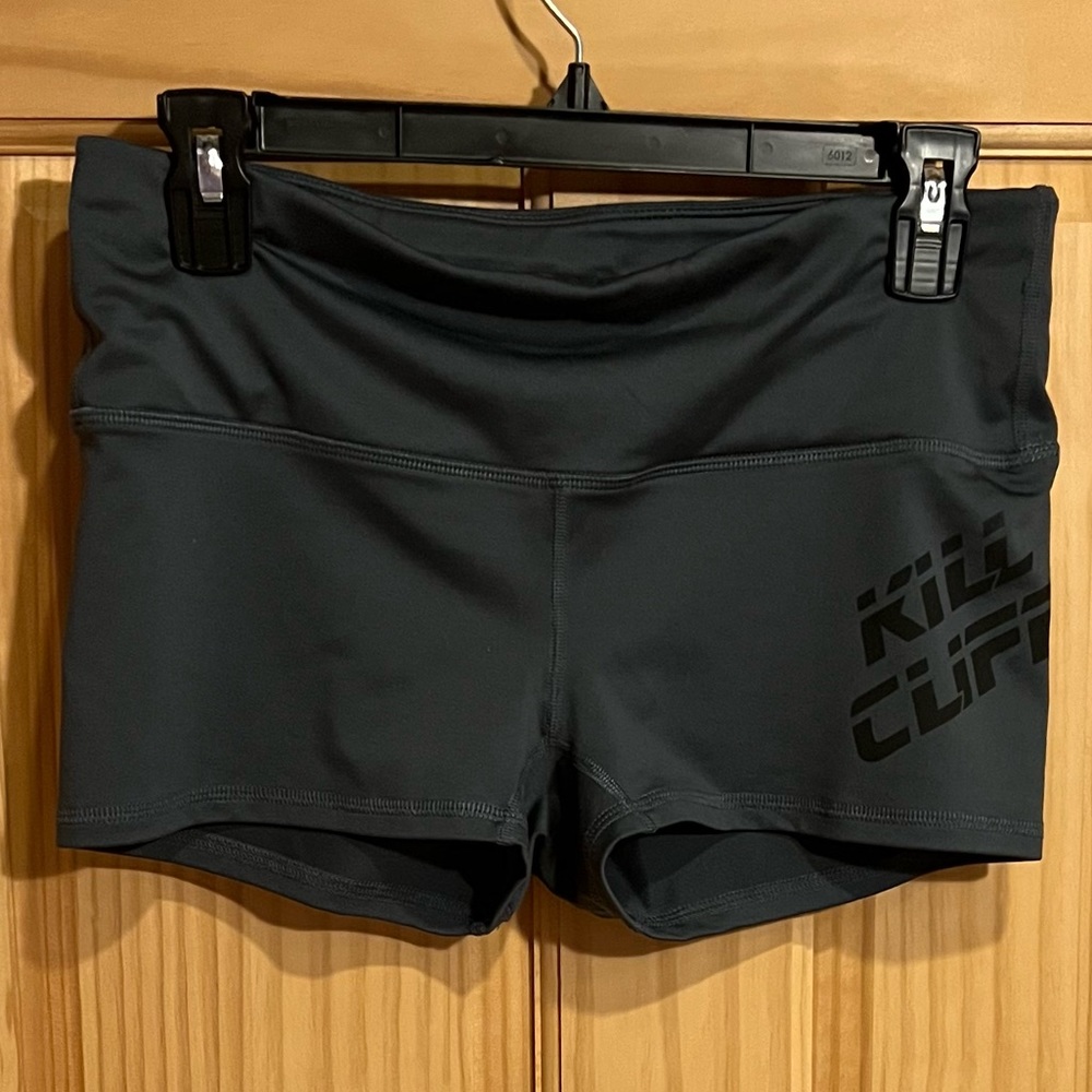 Women’s medium bike or volleyball or cheer shorts. Light gray.